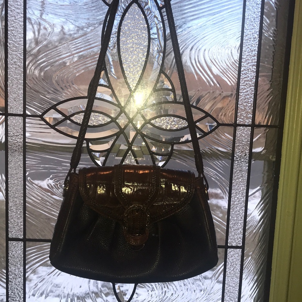 Brighton black leather handbag with brown tortoise accents, fancy rope handle.
